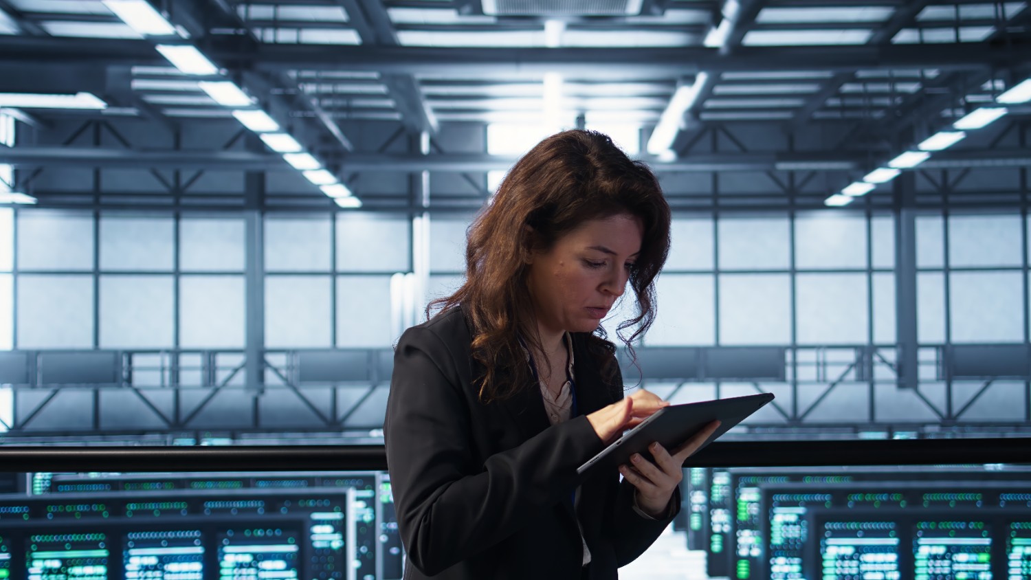 Analyst working at a laptop, representing human review inside an agent workflow